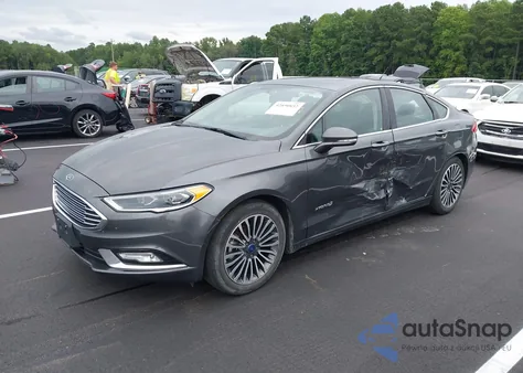 2018 Ford Fusion Hybrid Titanium z USA, uszkodzony, nr VIN 3FA6P0RUXJR124344